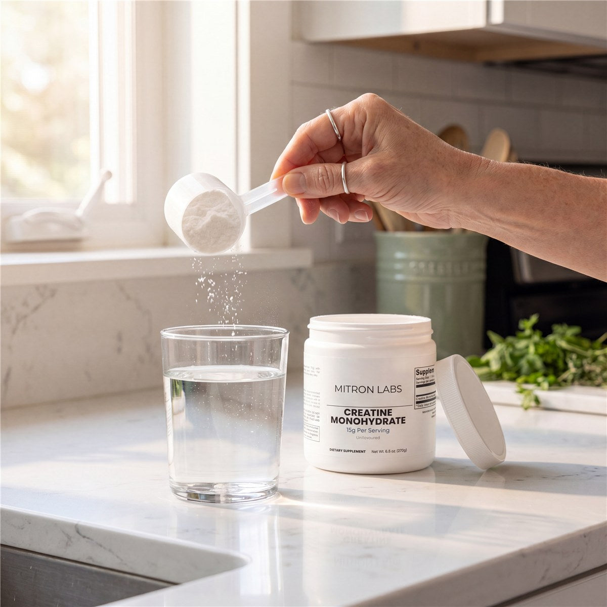 Pouring a 15g scoop into a glass of water